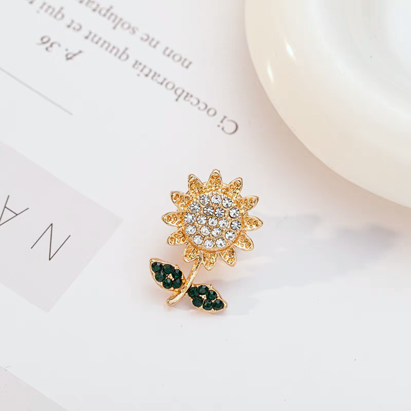 Petit broche en métal avec motif mélange (x12)